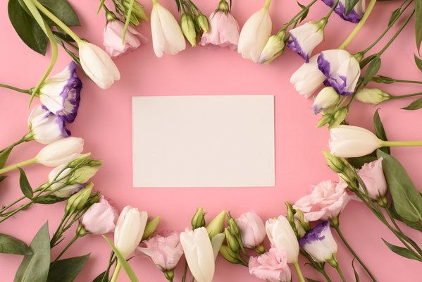 Flatlay of Piece of Paper and Spring Flowers Put in Round